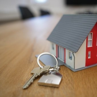 Model house with keys on a table