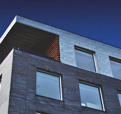 Modern apartment building with dark and light facade